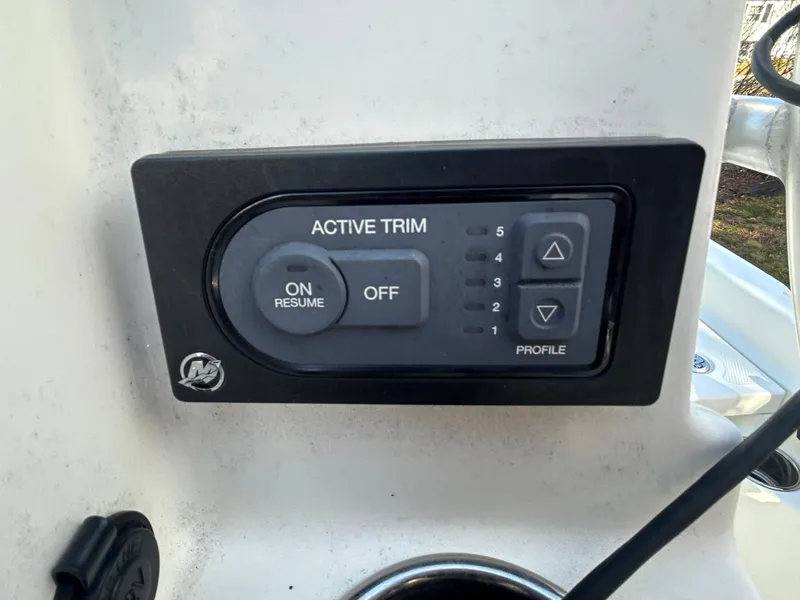 Slide: The Image of Active trim control panel on 2018 Mako 19 CPX boat. - 19