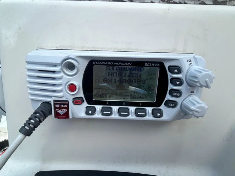 Slide: The Image of Standard Horizon Eclipse marine radio on 2018 Mako 19 CPX boat dashboard. - 20