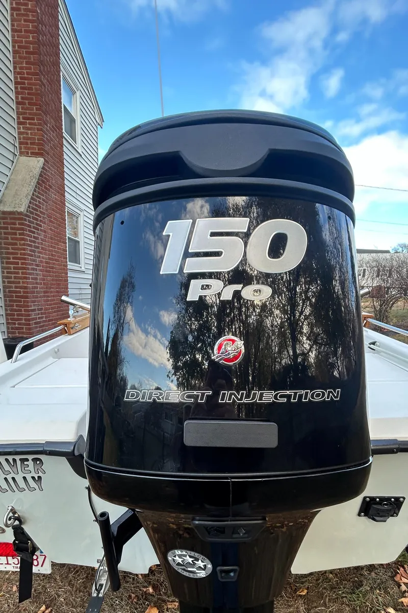 Slide: The Image of 2018 Mako 19 CPX boat with 150 Pro Direct Injection engine. - 25