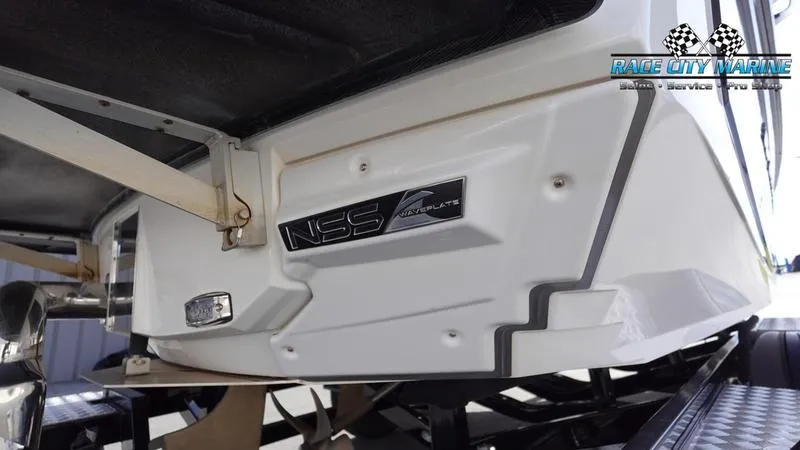 Slide: The Image of 2017 Nautique Super Air Nautique G23 boat rear view with NSS logo. - 11