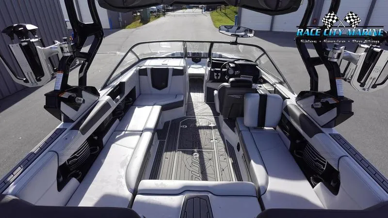 Slide: The Image of 2017 Nautique Super Air Nautique G23 interior with sleek seating and modern dashboard. - 17