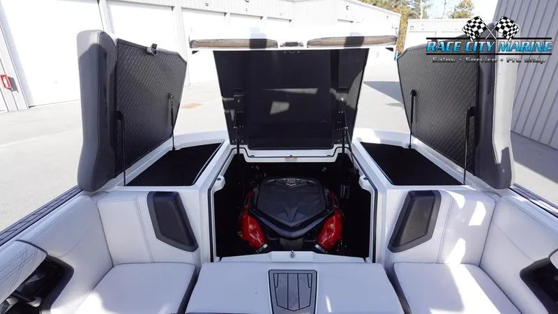 Slide: The Image of 2017 Nautique Super Air Nautique G23 boat engine compartment with open hatches. - 19