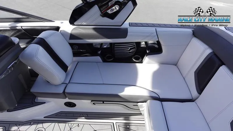 Slide: The Image of 2017 Nautique Super Air Nautique G23 interior with sleek white and black seating. - 24
