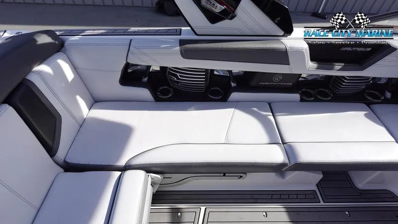 Slide: The Image of 2017 Nautique Super Air Nautique G23 interior with white leather seating and sleek design. - 25