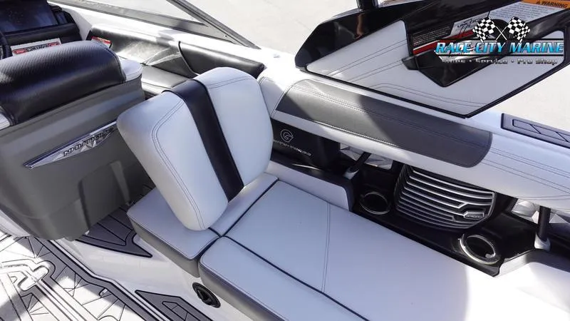Slide: The Image of 2017 Nautique Super Air Nautique G23 interior with sleek white and black seating. - 28