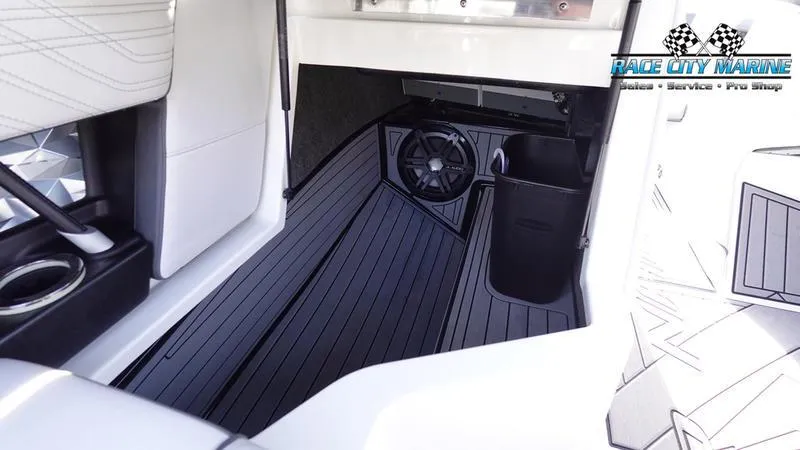 Slide: The Image of 2017 Nautique Super Air Nautique G23 interior with sleek black flooring and modern design. - 31