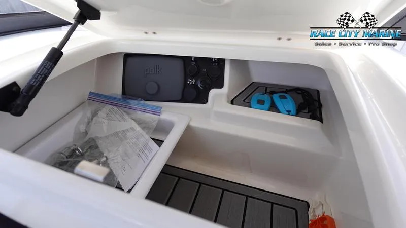 Slide: The Image of Storage compartment of 2017 Nautique Super Air Nautique G23 boat with accessories. - 32