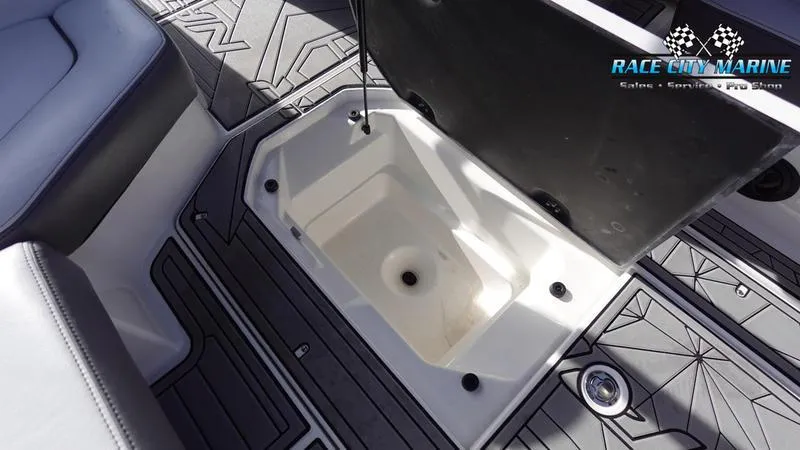 Slide: The Image of Open storage compartment in 2017 Nautique Super Air Nautique G23 boat interior. - 33