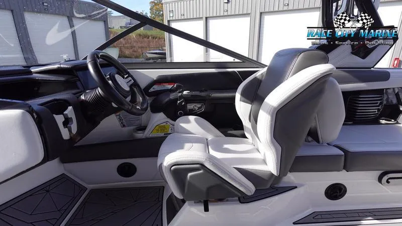 Slide: The Image of Interior of 2017 Nautique Super Air Nautique G23 boat with sleek seating and modern dashboard. - 34