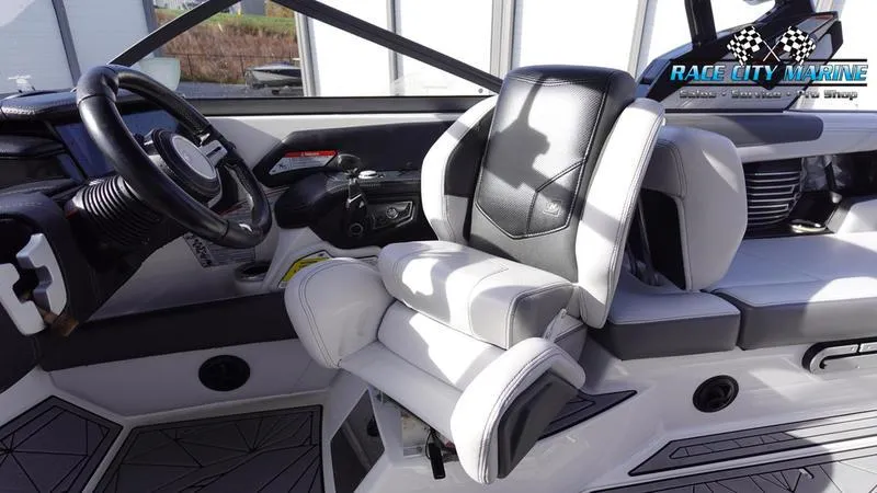 Slide: The Image of 2017 Nautique Super Air Nautique G23 interior with sleek black and white seating. - 35