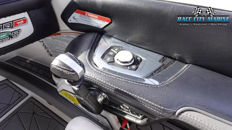 Slide: The Image of 2017 Nautique Super Air Nautique G23 boat control panel with Race City Marine logo. - 36