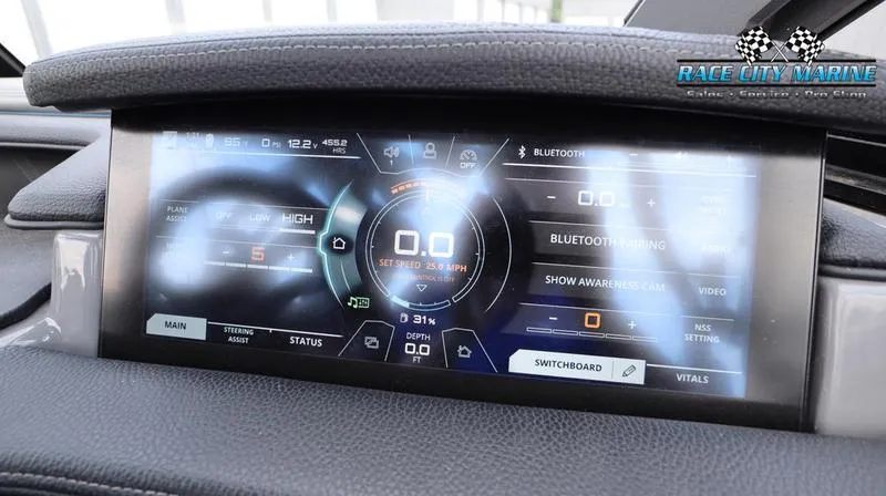 Slide: The Image of 2017 Nautique Super Air Nautique G23 dashboard display with digital controls and settings. - 40