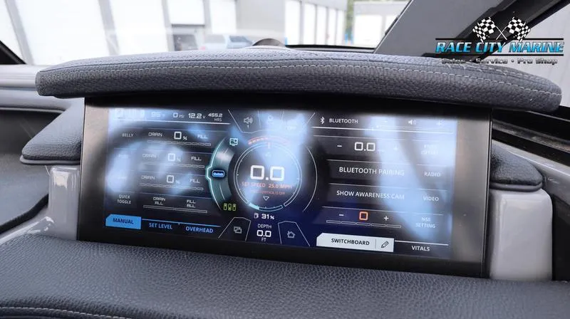 Slide: The Image of 2017 Nautique Super Air Nautique G23 dashboard display with digital controls and navigation. - 43