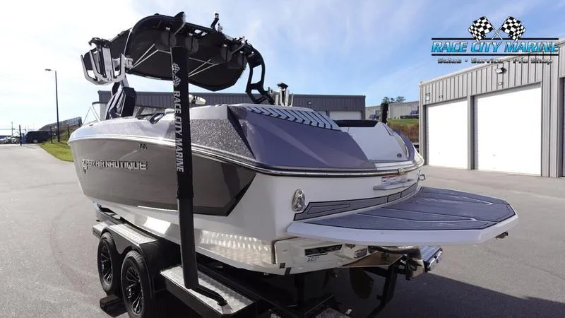 Slide: The Image of 2017 Nautique Super Air Nautique G23 boat on trailer at Race City Marine. - 7