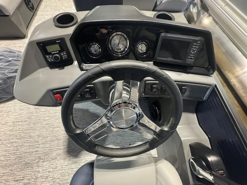 Slide: The Image of Steering console of 2025 Bennington 20 SL boat with modern controls and gauges. - 5