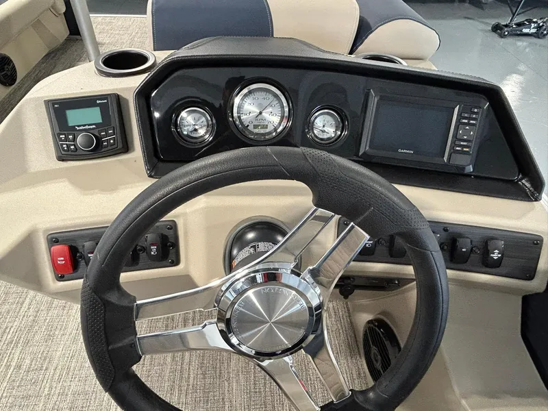 Slide: The Image of Steering console of 2025 Bennington 22 SSR boat with gauges and controls. - 12