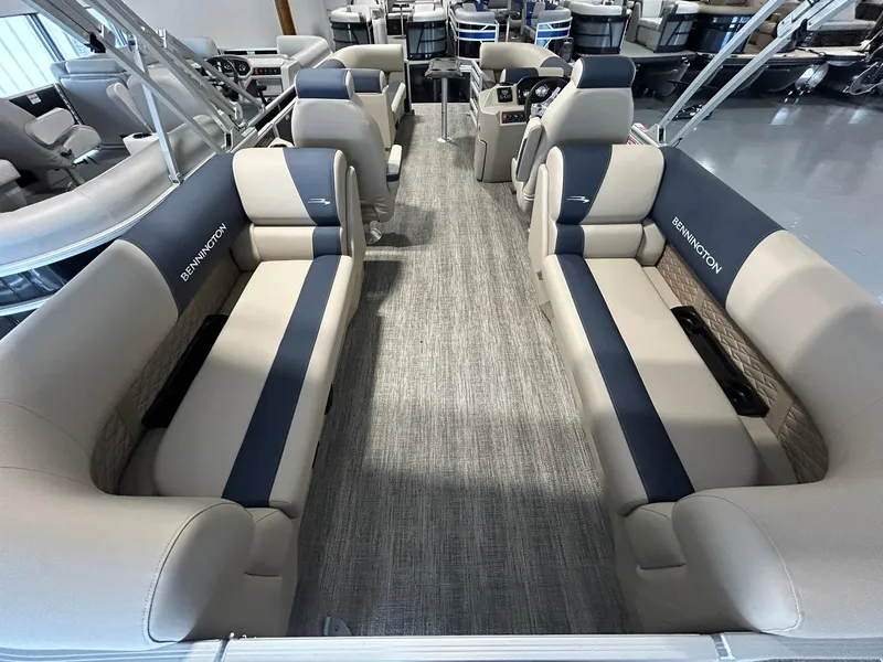 Slide: The Image of 2025 Bennington 22 SSR pontoon boat interior with plush seating and modern design. - 15