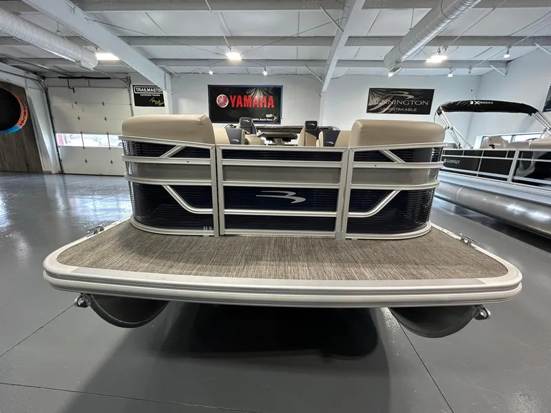 Slide: The Image of 2025 Bennington 22 SSR pontoon boat in showroom, front view. - 3