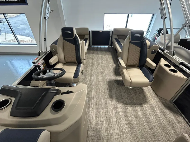 Slide: The Image of 2025 Bennington 22 SSR boat interior with plush seating and modern helm. - 9