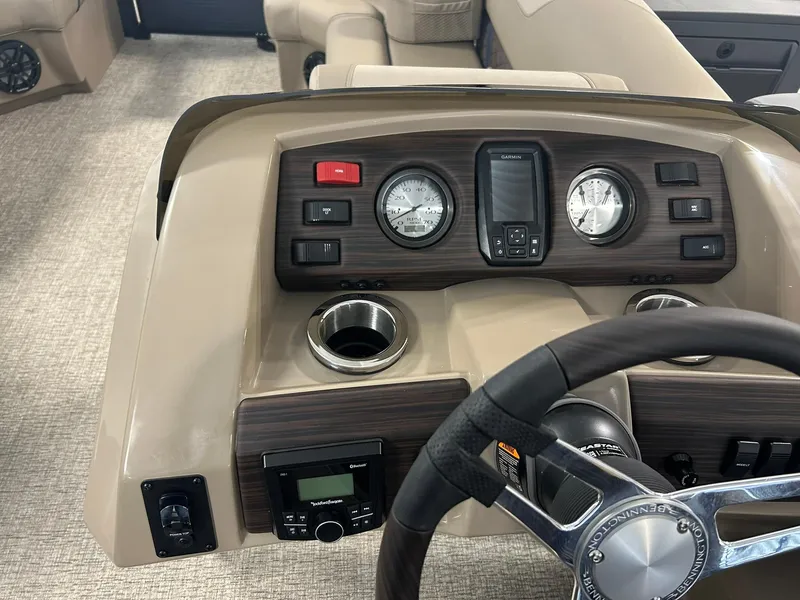 Slide: The Image of Dashboard of 2025 Bennington 22 SXSB boat with steering wheel and controls. - 10