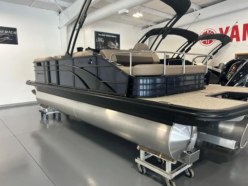 Slide: The Image of 2025 Bennington 22 SXSB pontoon boat displayed in showroom. - 3