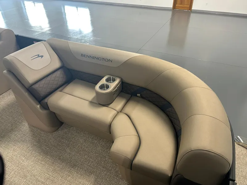 Slide: The Image of Luxurious seating on 2025 Bennington 22 SXSB boat with cup holders and elegant design. - 7