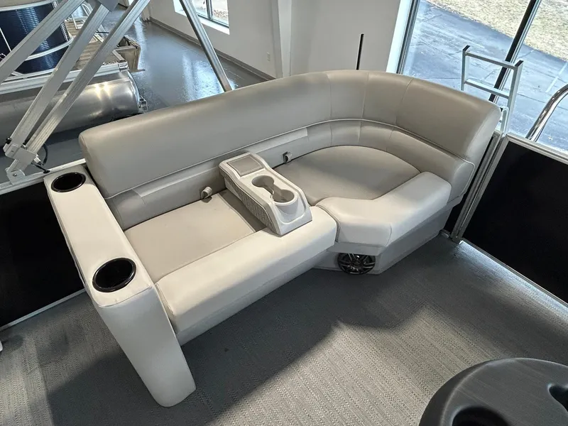 Slide: The Image of Luxurious seating on 2025 Godfrey Xperience 2286 SBX pontoon boat with cup holders and armrest. - 10