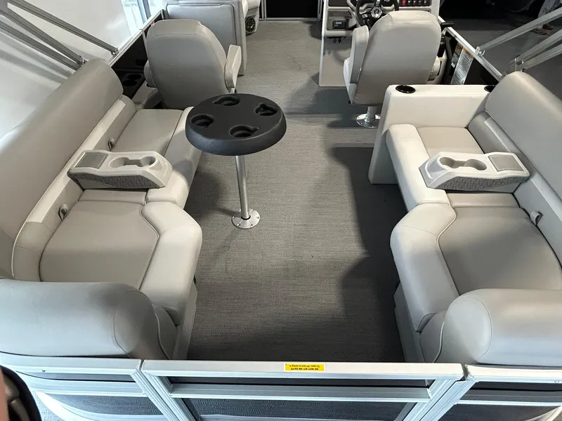 Slide: The Image of Interior of 2025 Godfrey Xperience 2286 SBX pontoon boat with plush seating and table. - 11