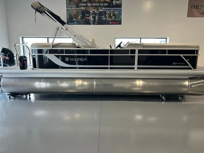 Slide: The Image of 2025 Godfrey Xperience 2286 SBX pontoon boat in showroom, side view. - 12