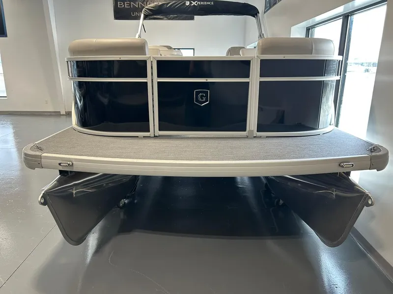 Slide: The Image of 2025 Godfrey Xperience 2286 SBX pontoon boat in showroom, rear view. - 13