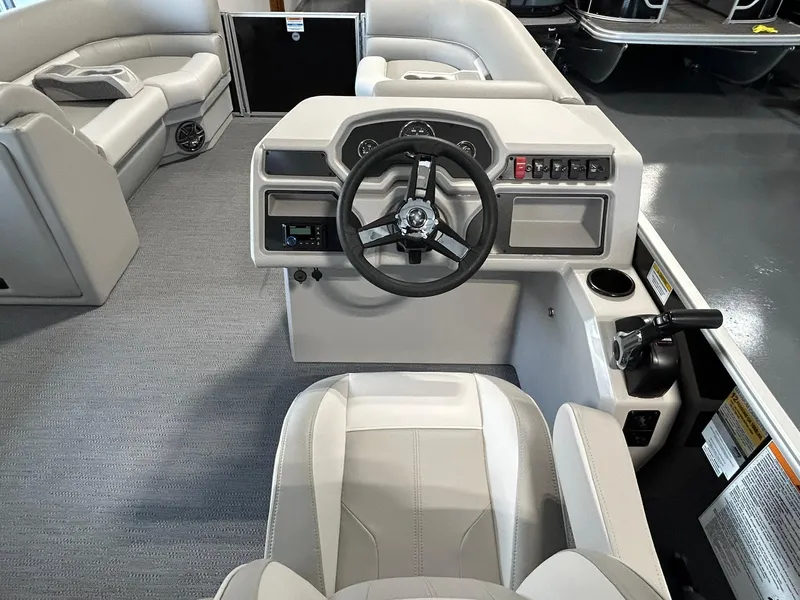 Slide: The Image of 2025 Godfrey Xperience 2286 SBX boat interior with steering console and seating. - 5