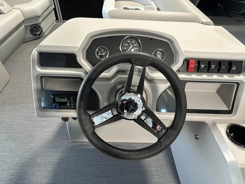 Slide: The Image of Steering console of 2025 Godfrey Xperience 2286 SBX boat with modern controls and gauges. - 6