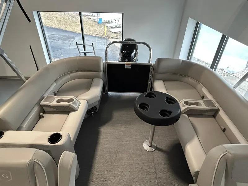 Slide: The Image of Interior of 2025 Godfrey Xperience 2286 SBX pontoon boat with plush seating and table. - 8
