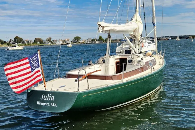 Slide: The Image of Sailboat "Julia," Rustler 33, 2017, with American flag, anchored in Westport, MA waters. - 9
