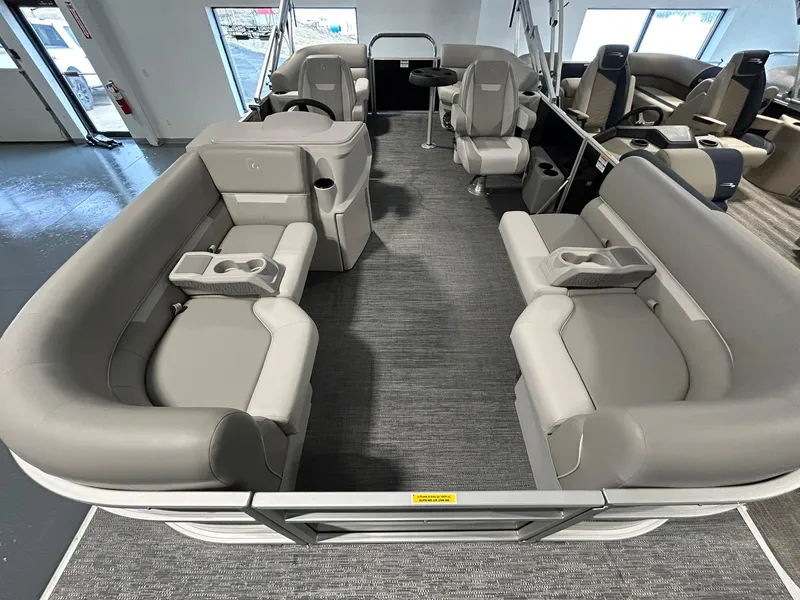 Slide: The Image of Interior of 2025 Godfrey Xperience 2086 SBX pontoon boat with gray seating and cup holders. - 1