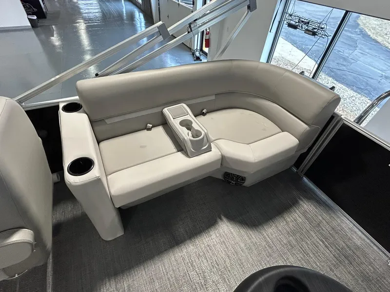 Slide: The Image of 2025 Godfrey Xperience 2086 SBX boat interior with gray seating and cup holders. - 10