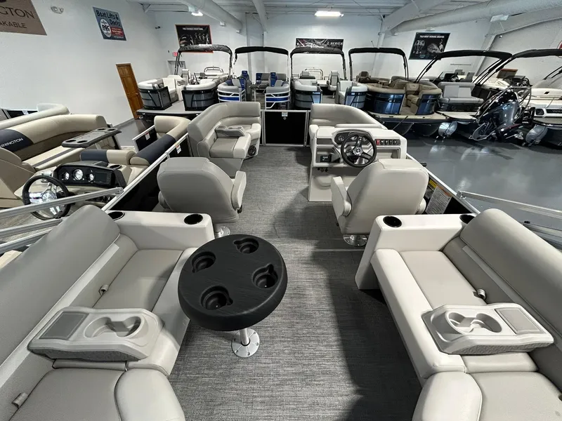 Slide: The Image of 2025 Godfrey Xperience 2086 SBX pontoon boat interior with seating and steering console. - 13