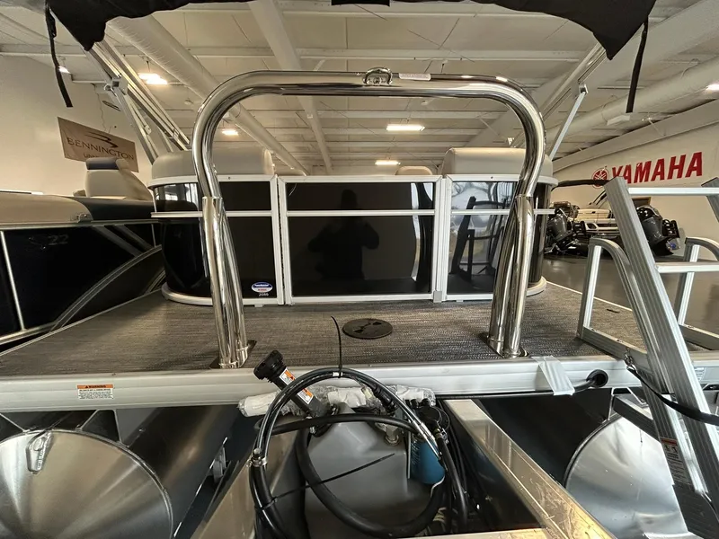 Slide: The Image of 2025 Godfrey Xperience 2086 SBX pontoon boat interior with stainless steel railing and Yamaha signage. - 17