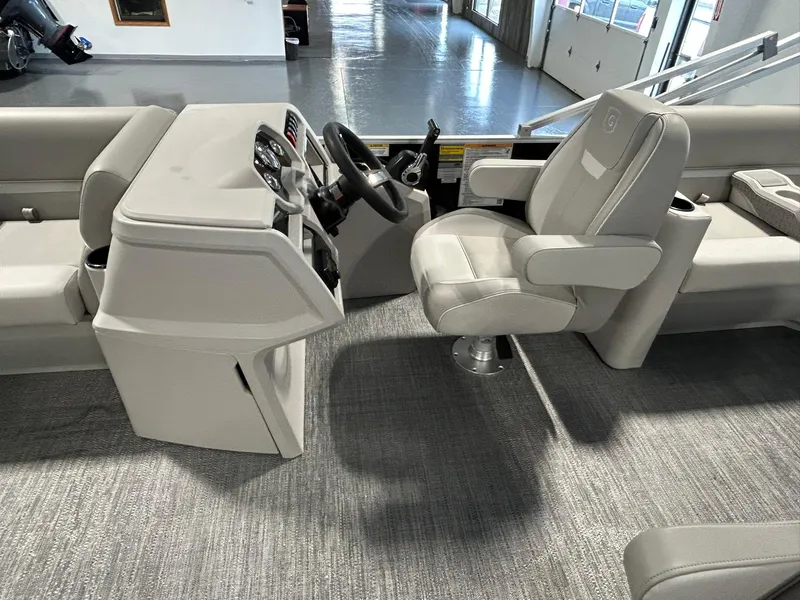 Slide: The Image of Interior of 2025 Godfrey Xperience 2086 SBX boat with modern helm and seating. - 4