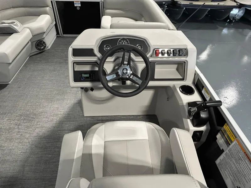 Slide: The Image of 2025 Godfrey Xperience 2086 SBX boat interior with steering wheel and control panel. - 5