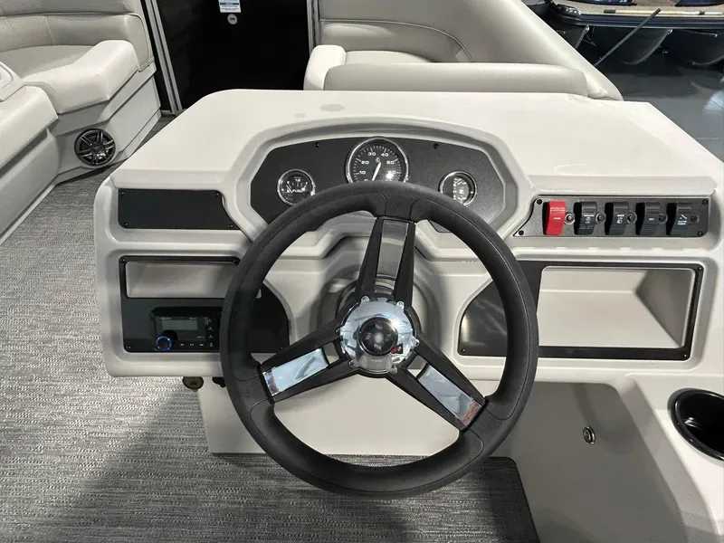 Slide: The Image of Steering console of 2025 Godfrey Xperience 2086 SBX boat with modern controls and gauges. - 6