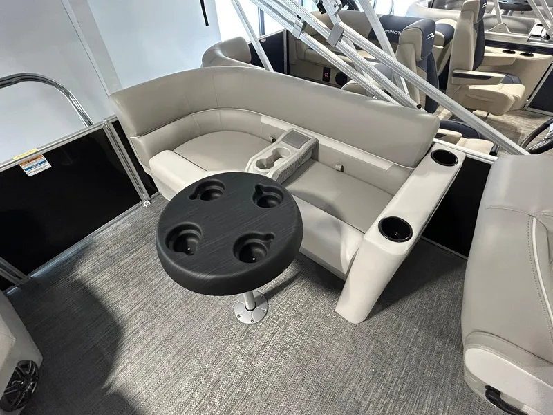 Slide: The Image of 2025 Godfrey Xperience 2086 SBX interior with gray seating and cup holders. - 9