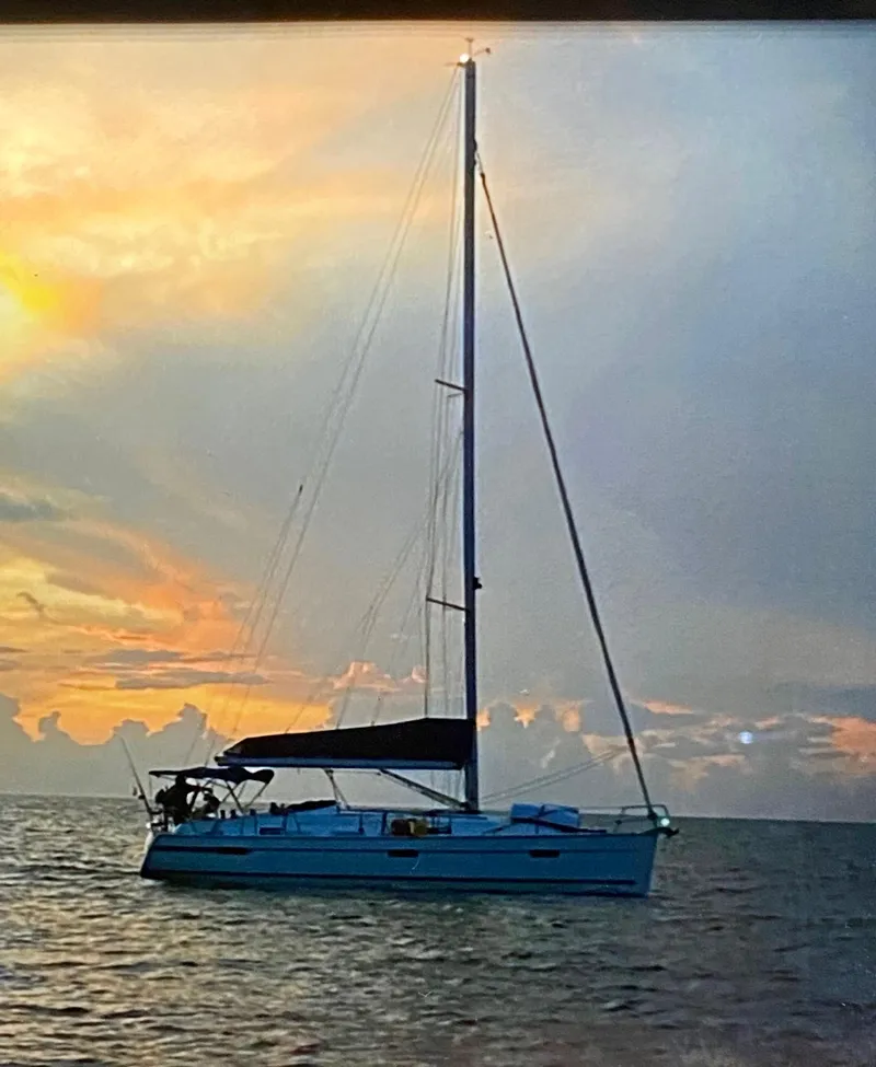 Slide: The Image of Sailing yacht Bavaria 36 Cruiser 2011 at sunset on calm sea. - 11