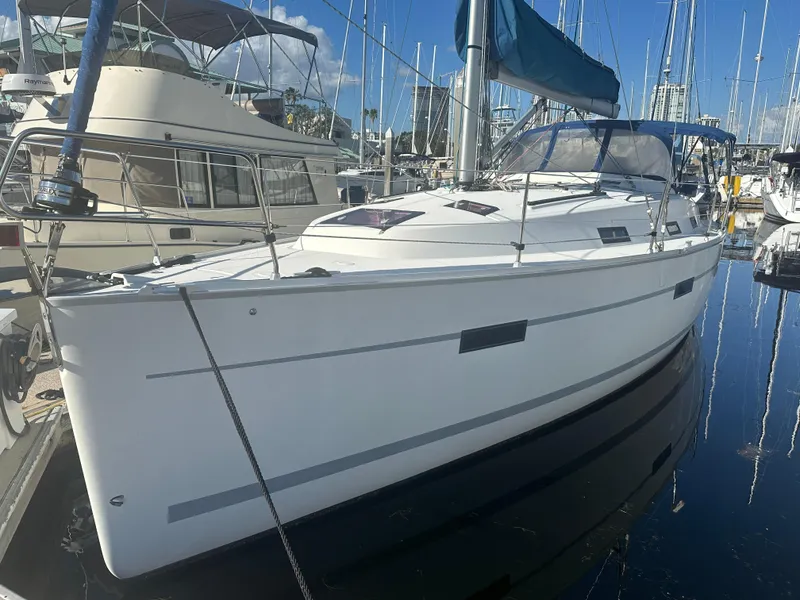 Slide: The Image of 2011 Bavaria 36 Cruiser sailboat docked in marina, clear sky, calm water. - 14