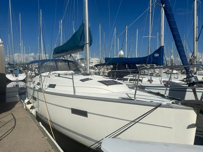 Slide: The Image of 2011 Bavaria 36 Cruiser sailboat docked in a marina under clear blue skies. - 15