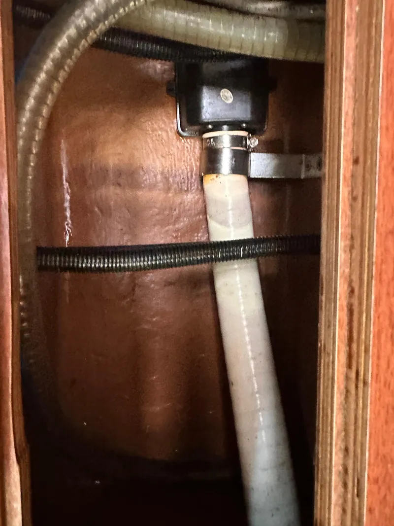 Slide: The Image of Boat plumbing system inside Bavaria 36 Cruiser, 2011 model, showing hoses and fittings. - 32