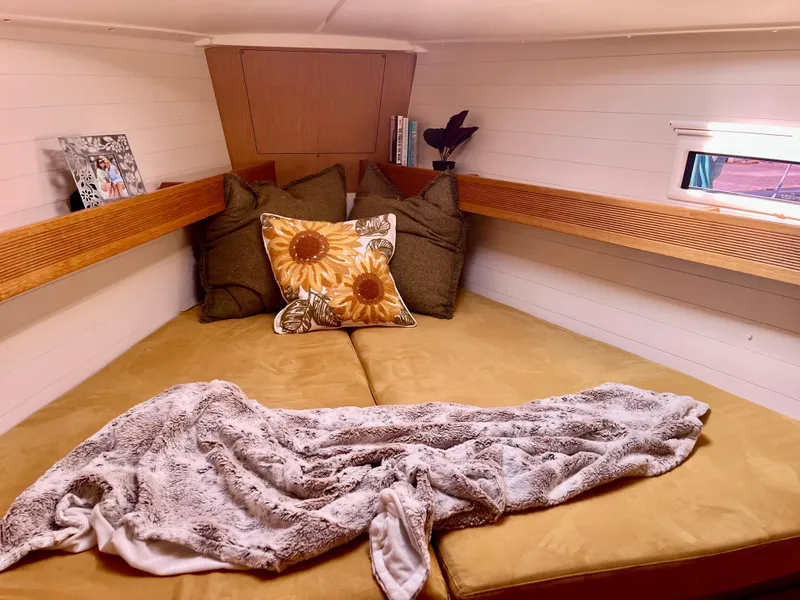 Slide: The Image of Cozy cabin interior of 2011 Bavaria 36 Cruiser with cushions and blanket. - 4