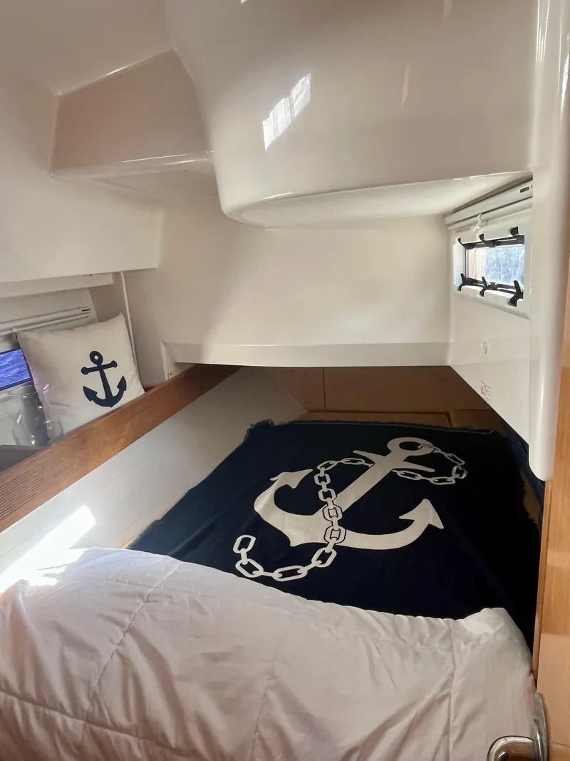 Slide: The Image of Cozy cabin interior of 2011 Bavaria 36 Cruiser with nautical-themed decor. - 8