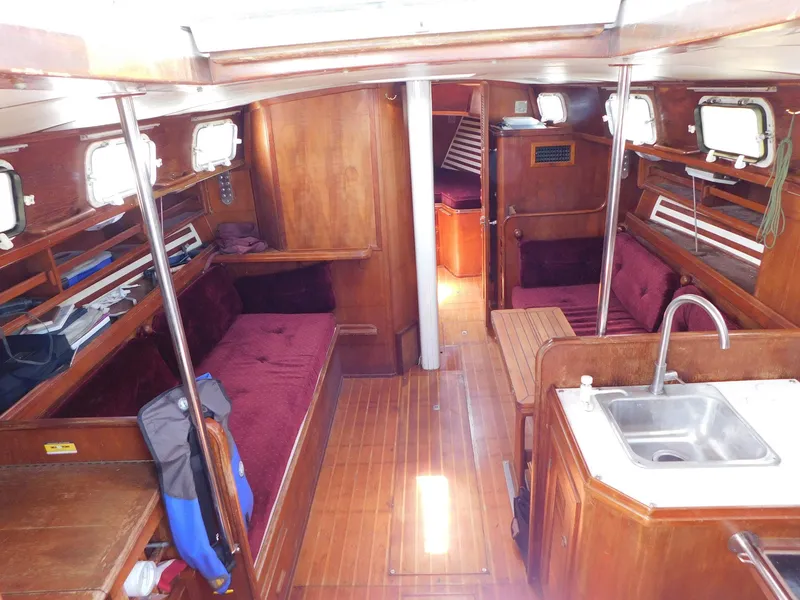 Slide: The Image of Interior of 1984 Endeavour 35.5 Sloop with wood finish and cozy seating. - 13