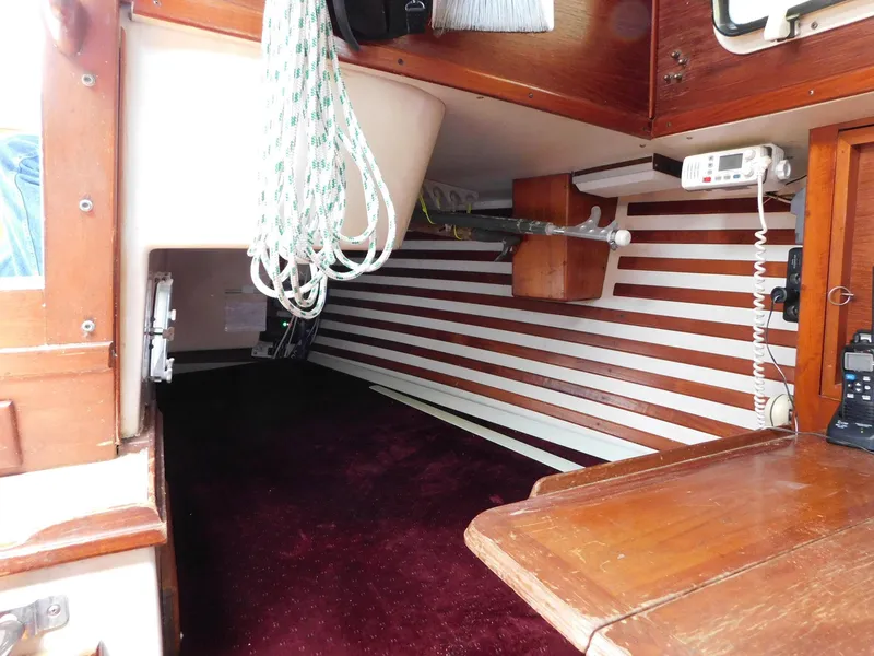 Slide: The Image of Interior of 1984 Endeavour 35.5 Sloop with striped walls and marine equipment. - 17
